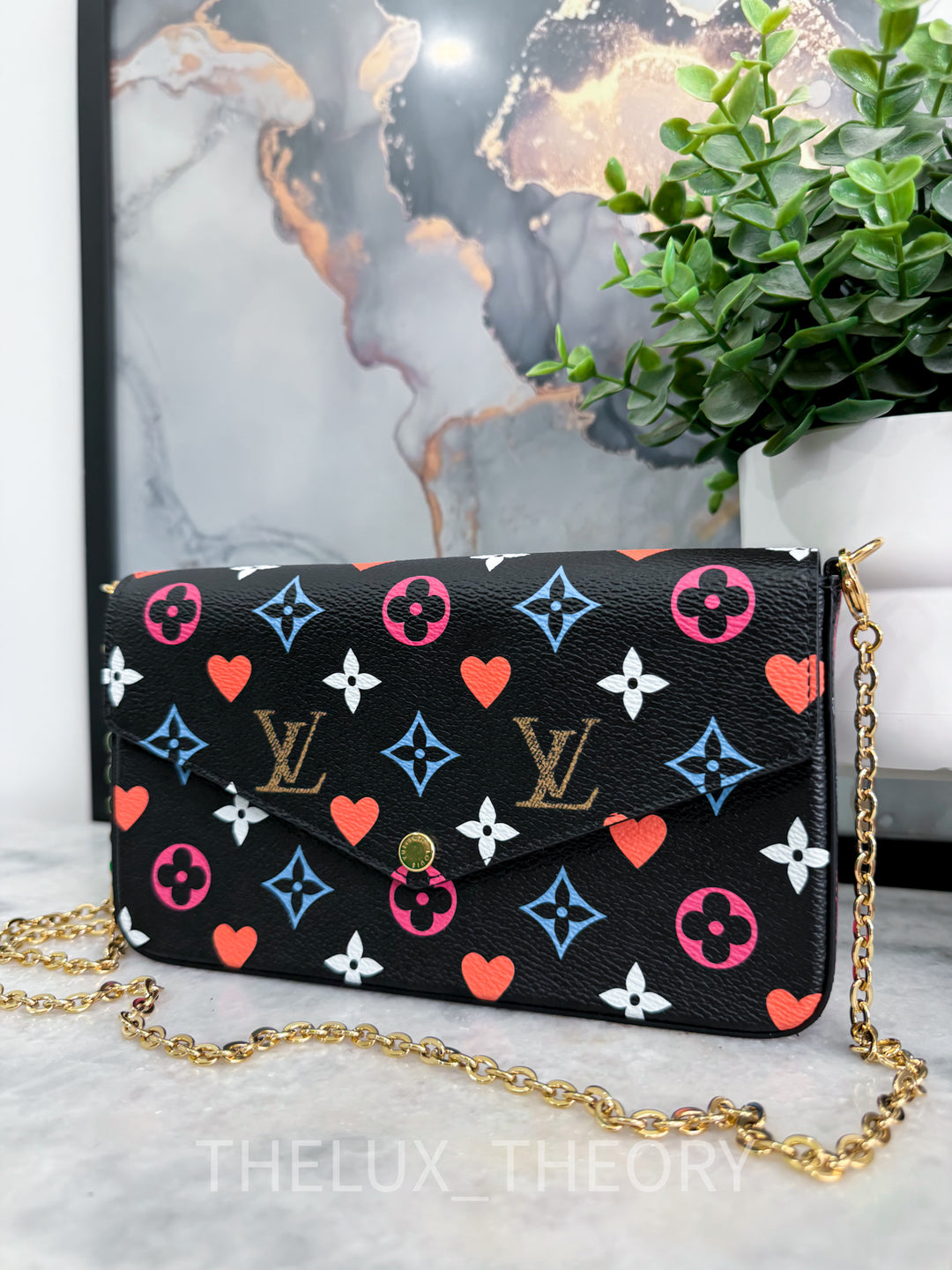 L.V. POCHETTE FELICIE GAME ON